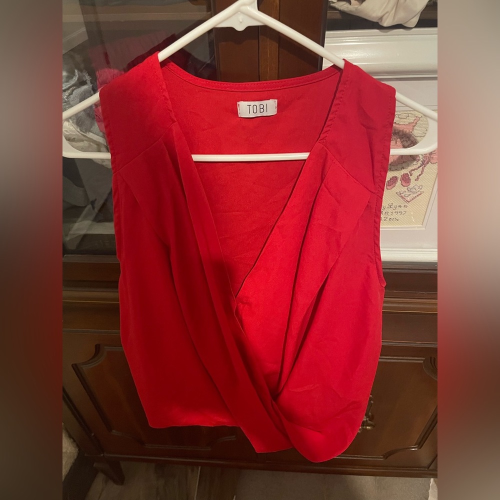 Red plunge neck blouse